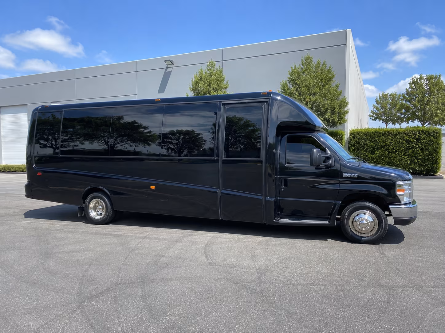 Friends laughing during a party bus celebration in West Palm Beach